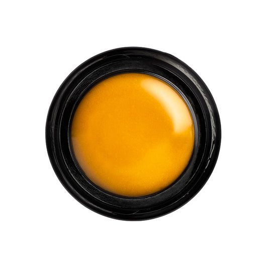 Black container with a yellowish-brown substance on a white background
