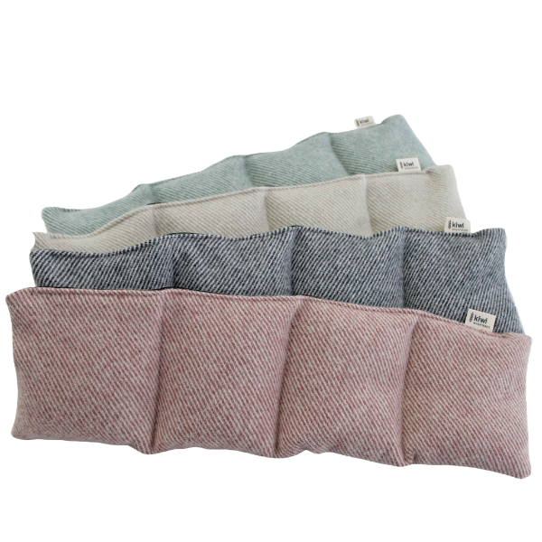 Set of fabric storage bags in various colors on a white background