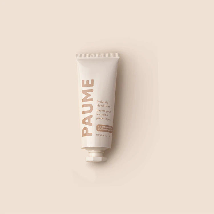 PAUME hand balm tube on a beige background