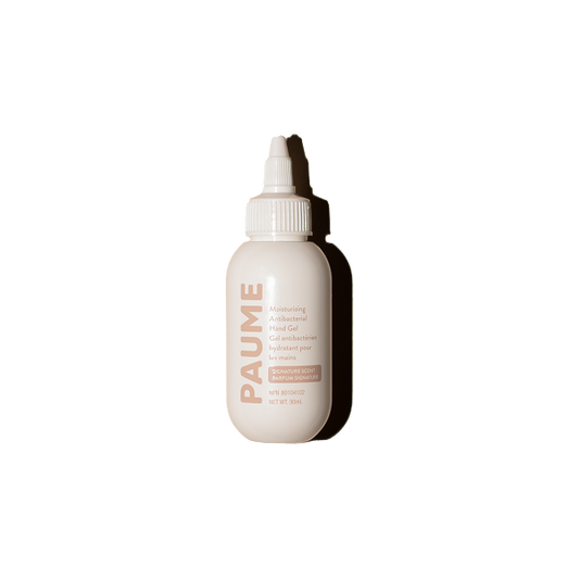Skincare bottle with a white cap on a white background