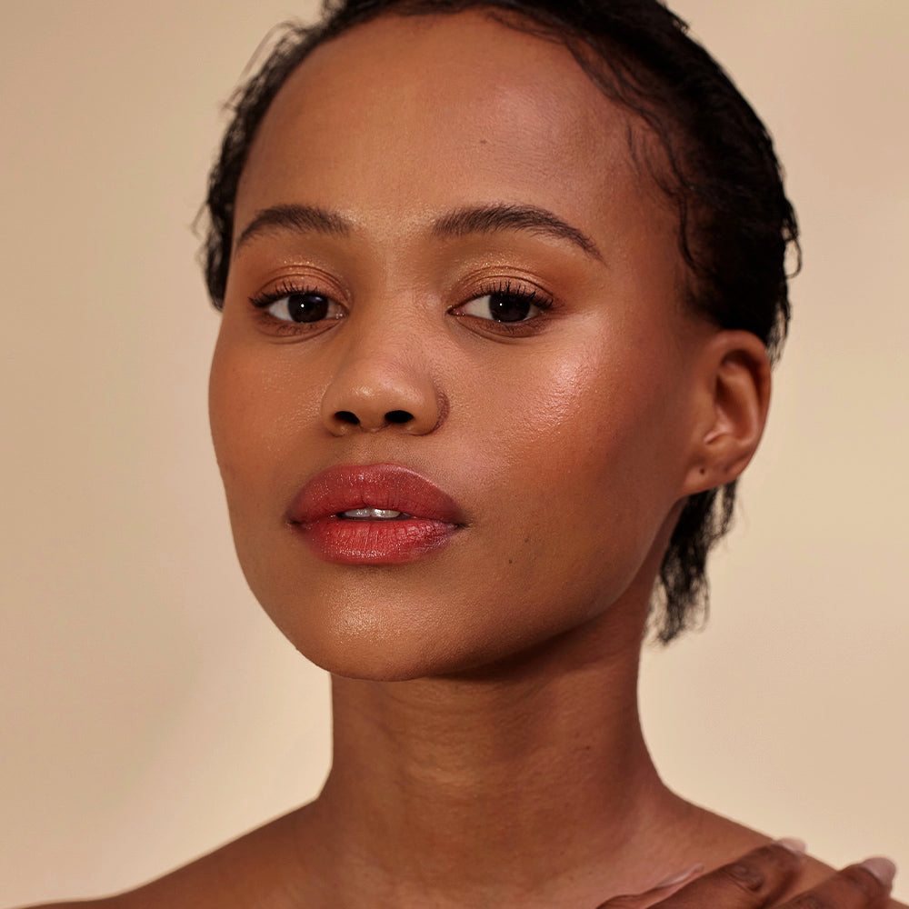 Close-up of a woman with a neutral background