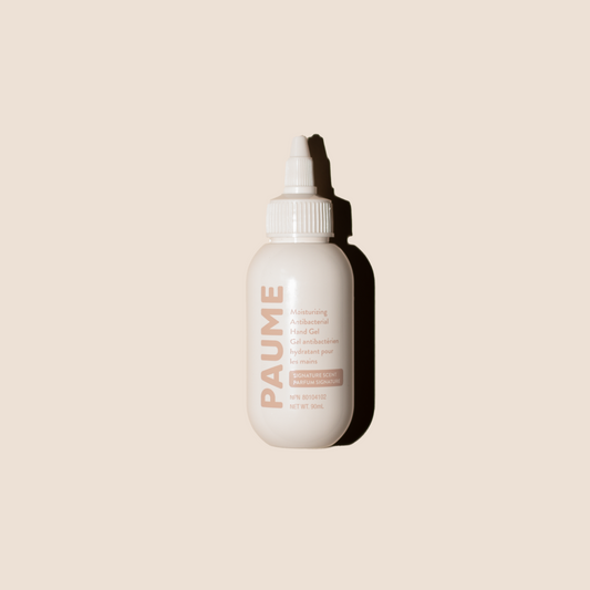 White bottle with a dropper labeled 'PAUME' on a beige background