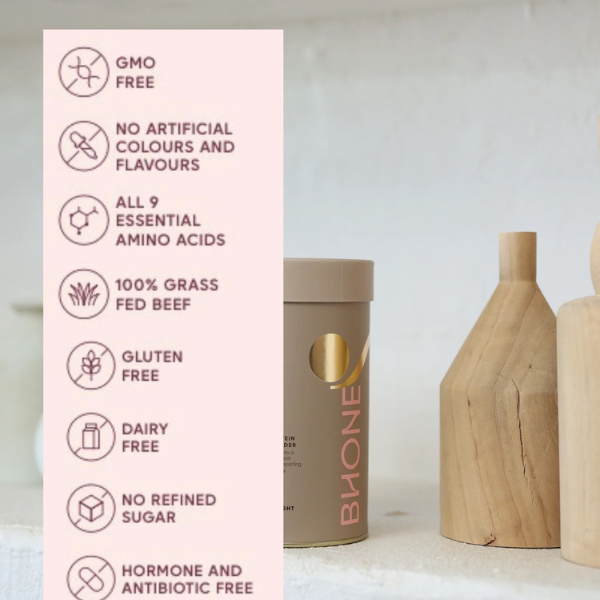 Product packaging with health benefits listed on a pink card, next to wooden bottles.